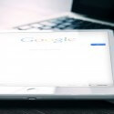 close-up of a mobile devices with google search open