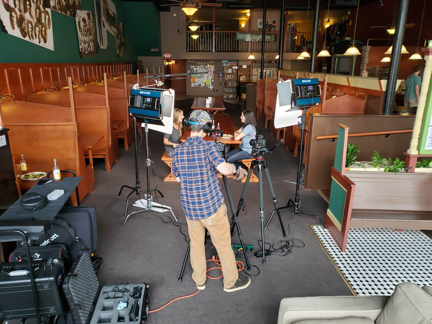 Person filming in a restaurant