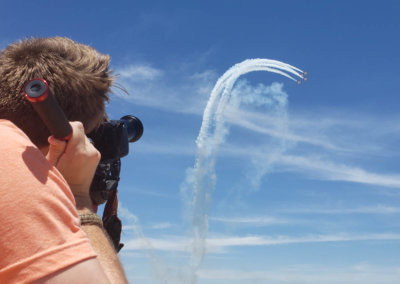 Person filming 3 planes flying acrobatically